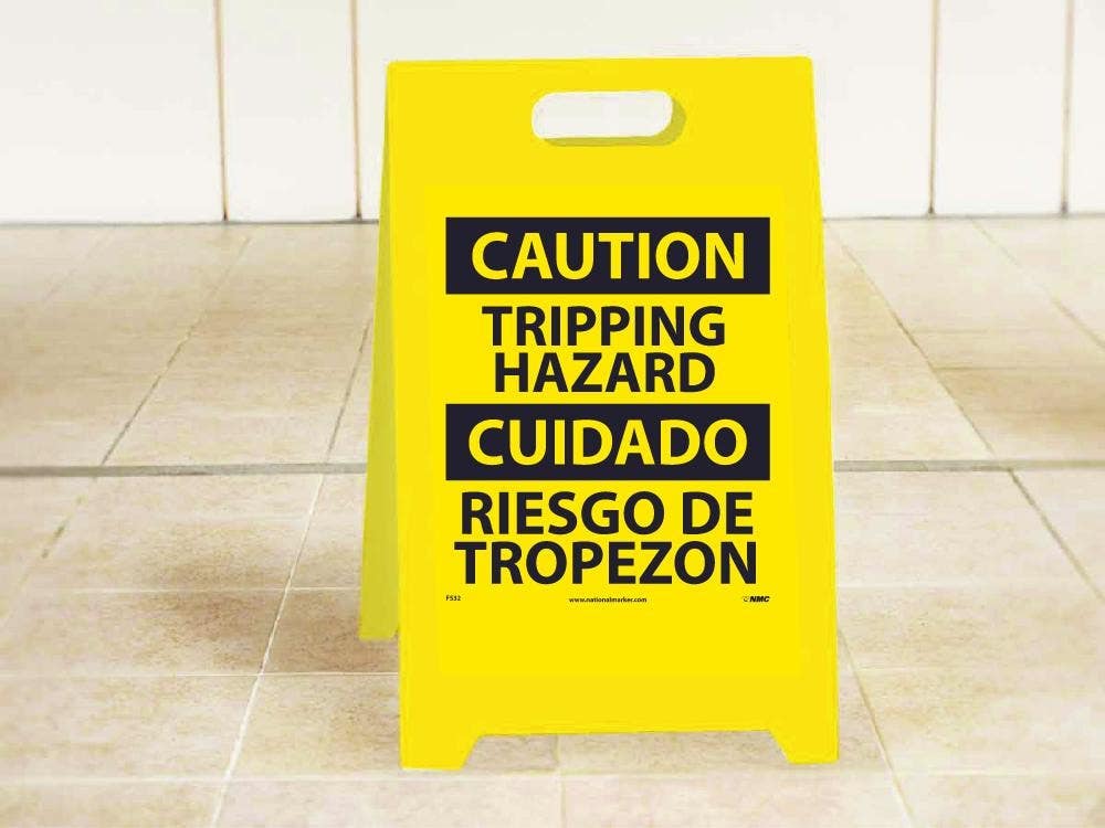 AccuformNMC FS32 Caution, Tripping Hazard - Bilingual Double-Sided Floor Sign, 19" x 12"