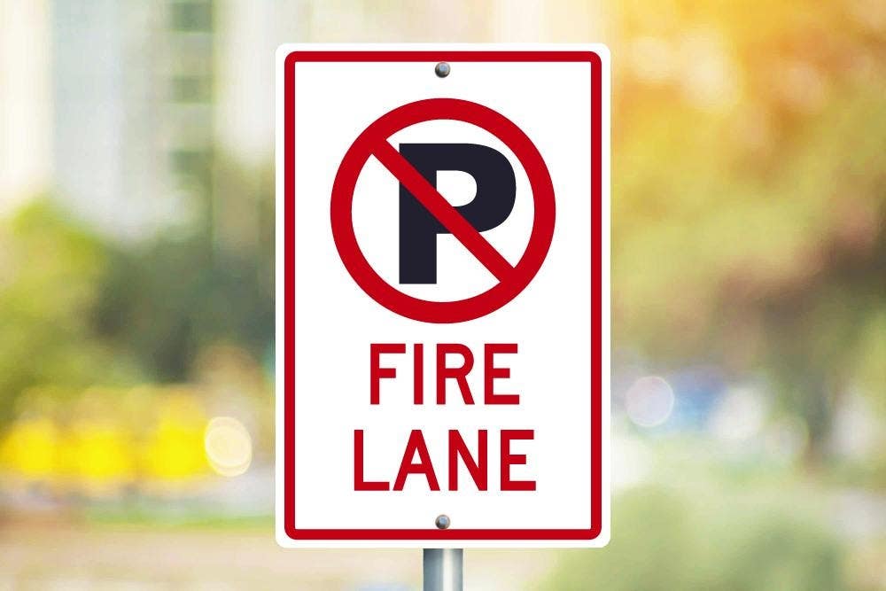 AccuformNMC TM0101 No Parking, Fire Lane Sign (Graphic), .080 EGP Reflective Aluminum, 18" x 12"