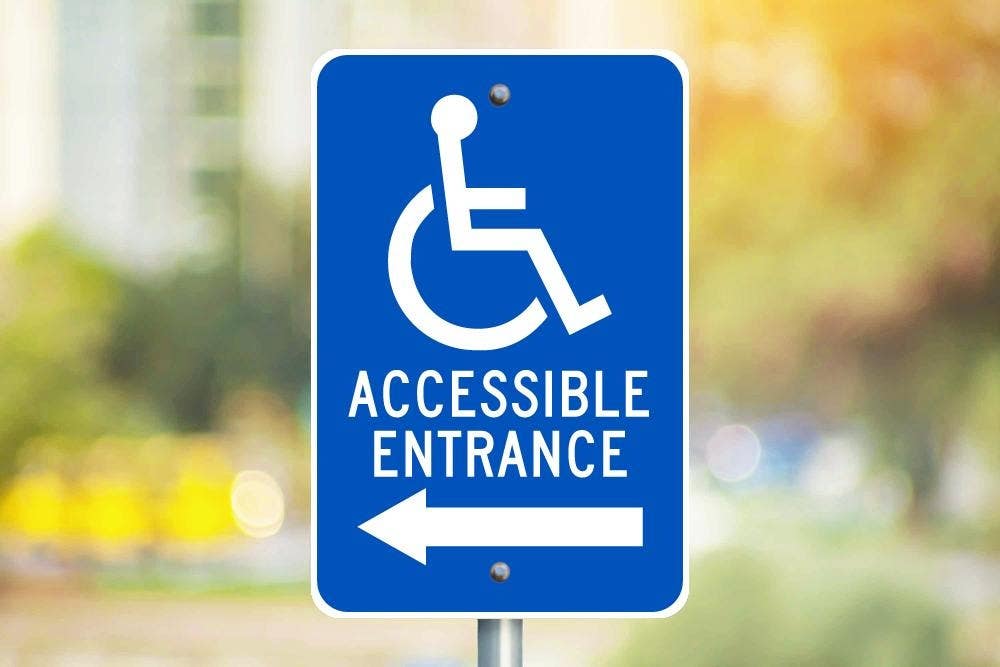 AccuformNMC FRA238RA Accessible Entrance w/ Left Arrow Sign (Graphic), .080 EGP Reflective Aluminum, 18" x 12"