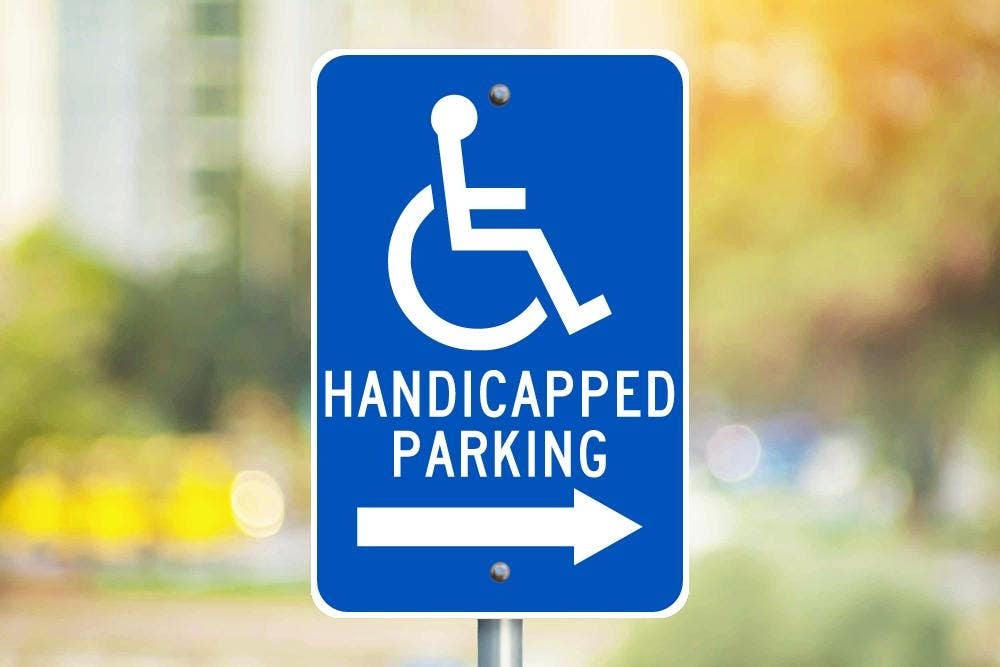 AccuformNMC FRA224RA Handicapped Parking w/ Right Arrow Sign (Graphic), .080 EGP Reflective Aluminum, 18" x 12"