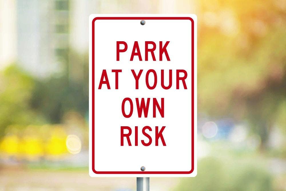 AccuformNMC TM56 Park At Your Own Risk Sign, 18" x 12"